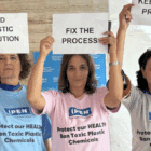 3 IPNers holding up signs at INC5.2
